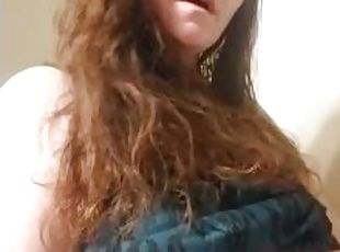 Sexy red head smoking and playing with titties