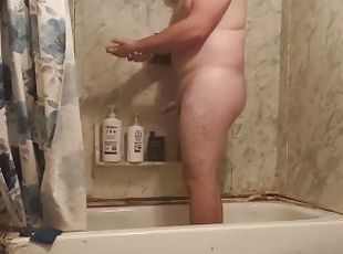 Fat guy jerks dick in shower and swallows own cum