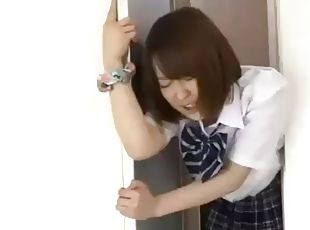 Japanese babe stuck in elevator doors and fucked