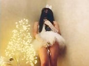 Chinese ladyboy wearing white gauze skirt cums next to Christmas tree