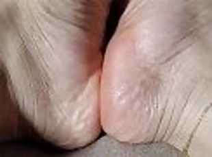 Moisturized feet ready for a massage