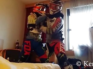 Ficht in motocross gear over who is going to be the bottom