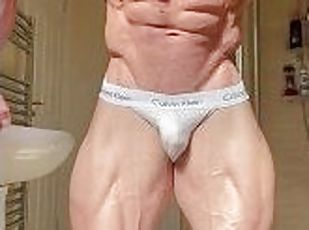 Young bodybuilder posing in jockstraps