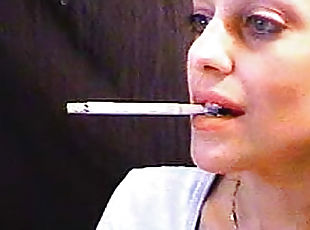 She smokes close up on webcam